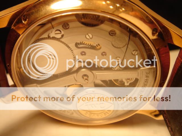 IWC PORTUGUESSE PERPETUAL CALENDAR IN 18K GOLD WITH BRN STRAP...CLASSY
